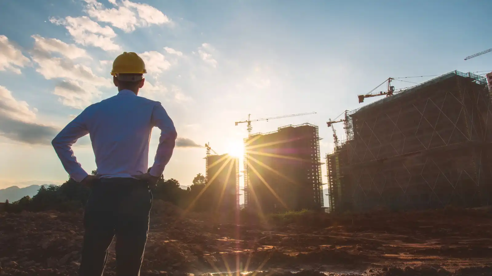 A builder looking at a construction job site